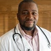African American male doctor wearing white coat and stethoscope